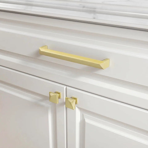 5 Pack Brushed Gold Cabinet Knobs Made From Solid Zinc Alloy shown on white cabinets