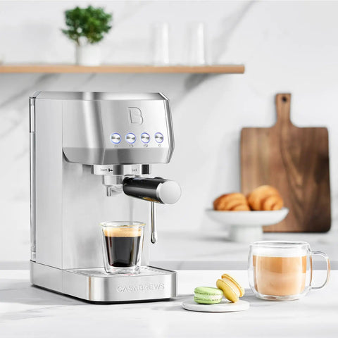 Essential Espresso Machine With 20 Bar Pressure, Stainless Steel Build, Milk Frother For Home Use, 43.9oz Water Tank, Sleek Silver Coffee Maker on counter with espresso and latte cups nearby.
