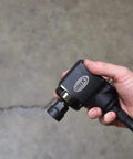 ONYX Half Inch Palm Impact Wrench With Remote Throttle, 445 Foot Pounds Torque, 25 Inch Swivel Hose in hand grip close-up