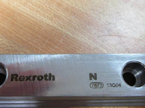 Close-up of Single guide rail R160520431 660.00 mm precision profile showing stamped markings on hardened steel for CNC use.