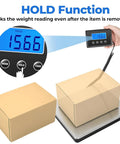 Rock Solid Digital Postal Scale For Packages Luggage And Mail displaying weight reading of 15.66 with tare hold function in use.