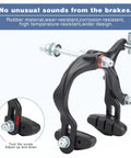 Aluminum Alloy Caliper Brake Set With Front And Rear Cables And Pads For Rim Brakes On Mountain Hybrid BMX And Cruiser Bikes Front And Rear Dual Central Spindle Design For More Sensitive Direct Braking Performance, close-up of dual spindle caliper and rubber brake pads.