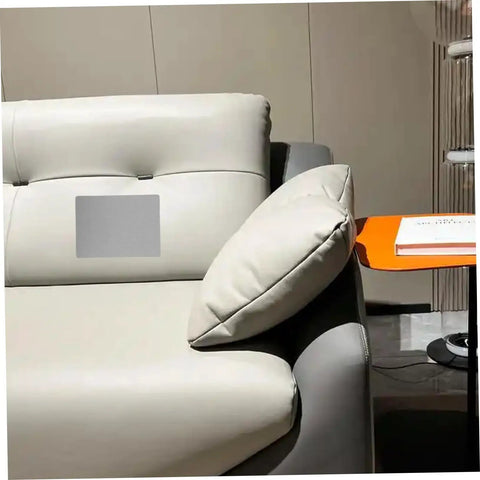Self Adhesive Linen Repair Patch Kit, 5 Pieces, Grey Appliques installed on a grey sofa for furniture fix