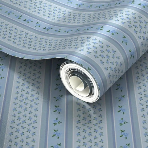 Blue Floral Stripe Wallpaper Featuring Silver Metallic Accents And Textured Fibrous Weave rolled up, showing floral design and colors.