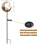 Lit Moonlit Solar Lantern For Outdoor Decor Ideal For Patio Path Garden Or Lawn Crackle Glass Globe Stake Light Waterproof Bronze Finish Warm LED Glow Easy Sun Powered Setup Upgraded Battery And Large Solar Panel with moon design and switch details.