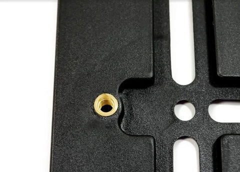 Close-up of Mercedes-Benz Front Bumper License Plate Holder Kit Bolt-On Relocator Mount, showing bolt hole detail