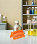 Cool Homoyoyo Lab Slide Drying Rack Pack on table with glass containers and chemicals in lab setting.