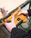 Person using Heavy Duty 650W Portable Oscillating Spindle Sander for smooth edge sanding on wood surface.