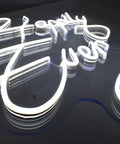 Close-up of Happily Ever After Neon Sign With Custom Wedding Wall Decor Flexible LED Neon Light on acrylic backplane.
