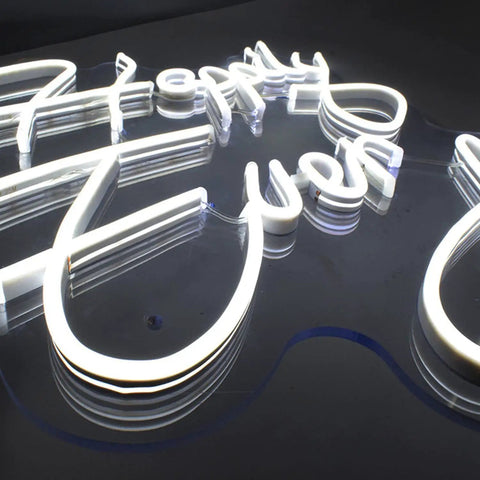 Close-up of Happily Ever After Neon Sign With Custom Wedding Wall Decor Flexible LED Neon Light on acrylic backplane.