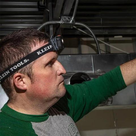 Headlamp Bracket With Comfy Fabric Strap For Removable Headlamps, worn by person in workshop, side view