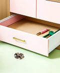 Open drawer with tools, showcasing Old School Vintage Zinc Alloy Cabinet Door Hinges 2 Pack on green surface