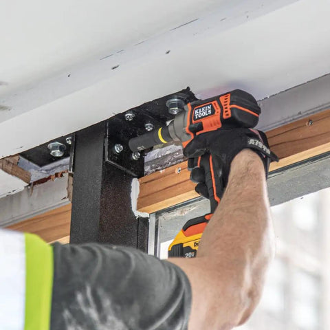 Worker using 2 In 1 Impact Socket Set With One Half Inch Drive, 5 Piece Deep Twelve Point Sockets in construction work.