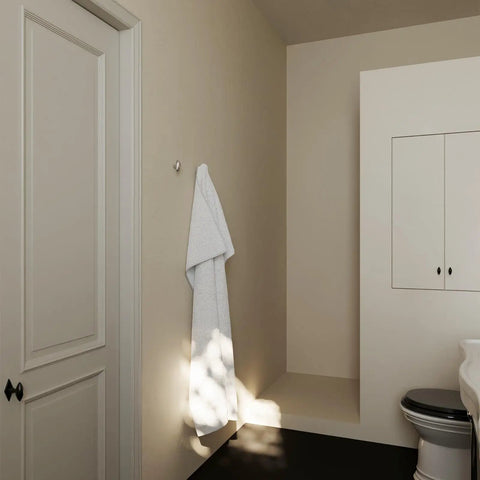 Sweet Looking Pebble Wall Hook Built From Top Shelf 304 Stainless Steel Keeps Your Everyday Essentials Off The Floor, holding a towel.