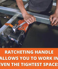Magnetic base drill in orange with ratcheting handle mounted to a metal frame; operator guides bar.