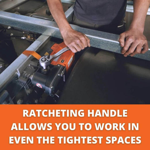 Magnetic base drill in orange with ratcheting handle mounted to a metal frame; operator guides bar.