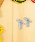 Heavy Duty Scaffold Guardrail Lock Pins 20 Pack Zinc Plated Steel Fixing Pegs on wood surface with tools.
