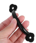 Hand holding a Vintage Black Alloy Drawer Pull Handle from set of 3 with screws, for cabinets, wardrobes, jewelry boxes, doors.