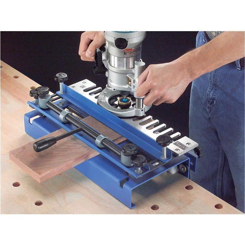Durable Dovetail Jig with Aluminum Template for One Half Inch Half Blind Drawer Joints setup on workbench, hands adjusting tool