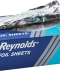 Blue box of Pop Up Interfolded Aluminum Foil Sheets In Silver, 500 Count Box, with foil sheet partially extracted
