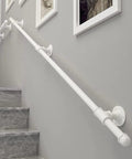 Tough As Nails 14ft Wall Mount Grab Rail And Stair Safety Railing For Home And Deck Use In Clean White Finish mounted alongside stairs.
