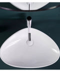 Bathroom Sink Ceramic Art Basin Large Size Creative Triangle Above Counter Basin from a top view on a dark surface.