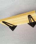 Built Tough Heavy Duty Rustic Shelf Brackets Wall Mount Supports Sturdy Triangle Steel Corbels with wood plank and black brackets.