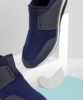 Rubber Shoe Heel Repair Pads 4mm White 1 Pair on blue background next to navy sneakers with textured surface.