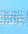 Leather Stamping Tools Pattern Kit 32 Piece Zinc Alloy Animal Punch Set for DIY Leather Craft and Saddle Making on blue background