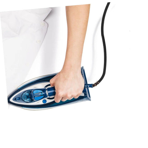 Person ironing white shirt using iron with Pro Grade Heavy Duty Steam Hose For Steam Iron Replacement High Temperature Hose attachment