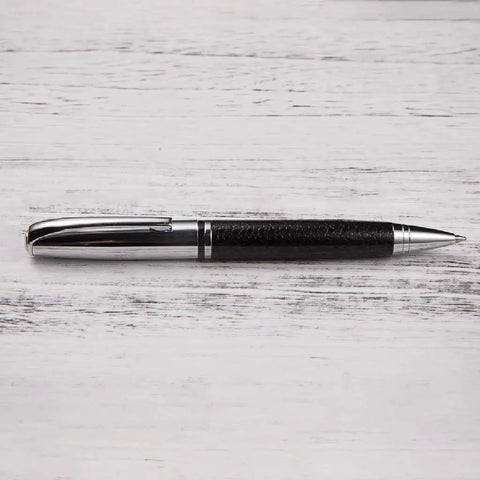 Rotary 0.5mm Ballpoint Pen Set with Leather Grip, Metal Body and Smooth Gel Ink, pen placed on wooden surface