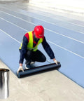 Tough As Nails Self Adhesive Waterproof Roofing Underlayment Roll With Aluminum Foil Layer applied over a surface by a worker.