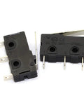 Two KW12-B micro limit switches with three-pin terminals and lever arm snap action, copper contacts visible, used for DIY projects and machinery.