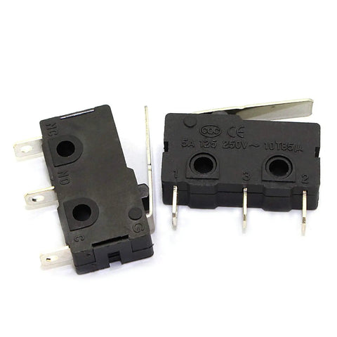 Two KW12-B micro limit switches with three-pin terminals and lever arm snap action, copper contacts visible, used for DIY projects and machinery.