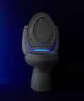 Reveal Nightlight Quiet Close Toilet Seat With Grip Tight Fit for elongated toilets, biscuit color, LED lighting in dark room