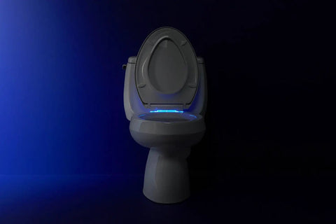 Reveal Nightlight Quiet Close Toilet Seat With Grip Tight Fit for elongated toilets, biscuit color, LED lighting in dark room