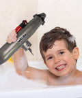 Child playing with Mini RC Submarine Toy For Bath Time And Pool Play, Realistic Sub Design With Propeller Accessories in bathtub