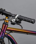 Double Lock On Mountain Bike Grips With Anti Slip Shock Absorbing Rubber For Vibration Dampening And All Day Comfort On Any Trail Black With Locking Rings installed on colorful MTB handlebar.