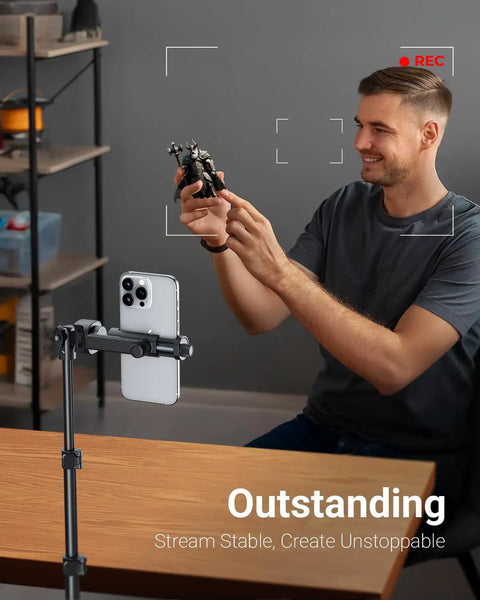 Man using 66 Inch Phone Tripod With Remote And Clamp Mount For iPhone And Android Extendable Stand For Video Recording