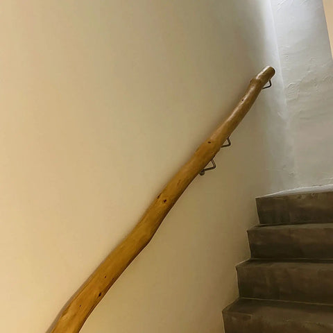 Natural Solid Wood Stair Handrail Eight Foot Non Slip Railing Delivers Top Tier Indoor Outdoor Safety Features Heavy Duty Build With No Sweat Mounting Brackets Included For Steady Support on a staircase