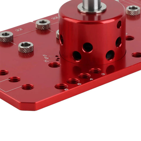 Top Tier 2 In 1 Shelf Pin And Cabinet Hinge Jig Kit Crafted From Solid Aluminum With Four Hardened Steel Drill Bits close-up of red drill guide.
