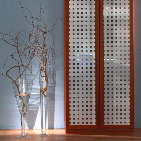 Decorative privacy window film installed on a wooden cabinet with vases, showcasing Privacy Window Film With Reusable Static Cling Transforms Glass Surfaces From Windows To Doors And Showers Repositionable And Removable Adds Personal Style And Privacy On Point 17 By 59 Inch Roll.
