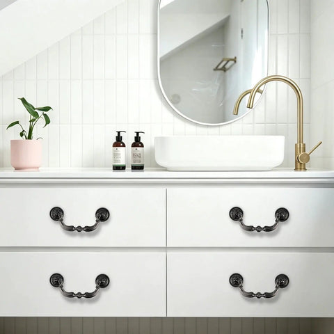 Four Pack Retro Drop Bail Drawer Pulls With Screws Black Finish Large Size L installed on white vanity in modern bathroom.