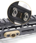 Rock Solid QD Sling Swivel And M System Rail Adapter featuring a tan mount and steel fittings on a rail system.
