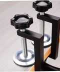 Close-up of adjustable patio sofa clips set for outdoor rattan furniture heavy duty wicker fasteners installed on table edge