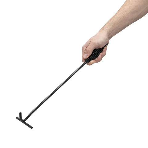 Hand holding Badass Heavy Duty Dutch Oven Lid Lifter with heat resistant grips for handling hot pots.