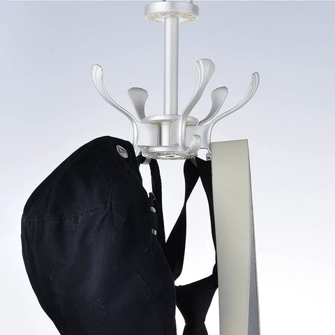 Straight Up Solid Wall Mounted Coat Rack With Five Rotating Metal Hooks, showing black hat on a hook, premium gold and white design.