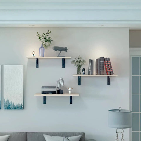 Rock Solid Heavy Duty Metal Corner Brackets For Floating Shelves in matte black holding decorative items on wall shelves.