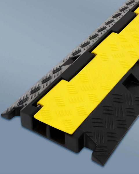 Close-up of Three Pack 2 Channel Cable Protector Ramps BeefedUp Built Tough For 11000 Lbs Per Axle, in yellow and black.