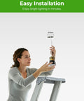 Woman installing YOVELOS 6-Pack 10W Trimless Recessed LED 3 Inch Slim Spotlight on a ladder, showcasing easy installation.